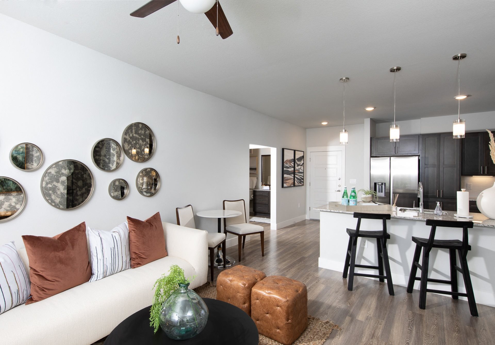 a living room opening up to a kitchen at a senior apartment community